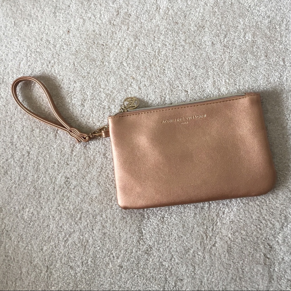 SOLD!! NWOT Rose Gold Clutch with IPhone Charger
